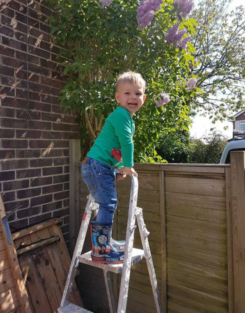 Joshua climbing ladder